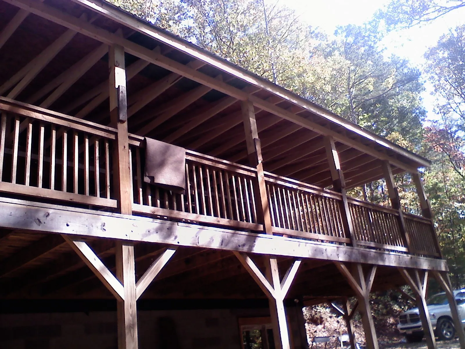 Timber framing under a new elevated porch and deck — Roof Leak Repair in Leroy by Roofing Brothers